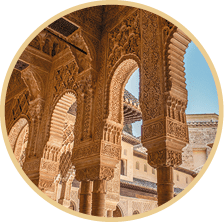 Granada, Spain - March 7, 2014: The Alhambra columns around the Court of the Lions in sunny morning 